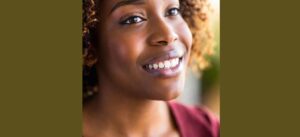 A woman with an overbite shares a smile.