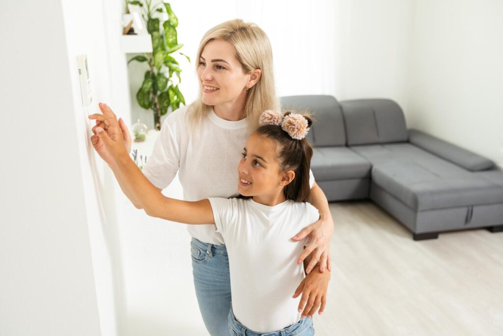 mother and daughter using heat pump system