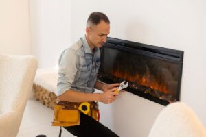 man working on fireplace repair